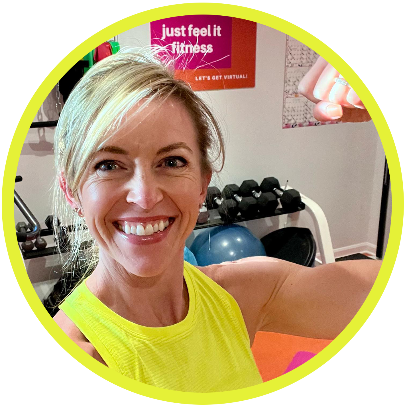 Personal trainer Meryl Marciante smiling and flexing her biceps.