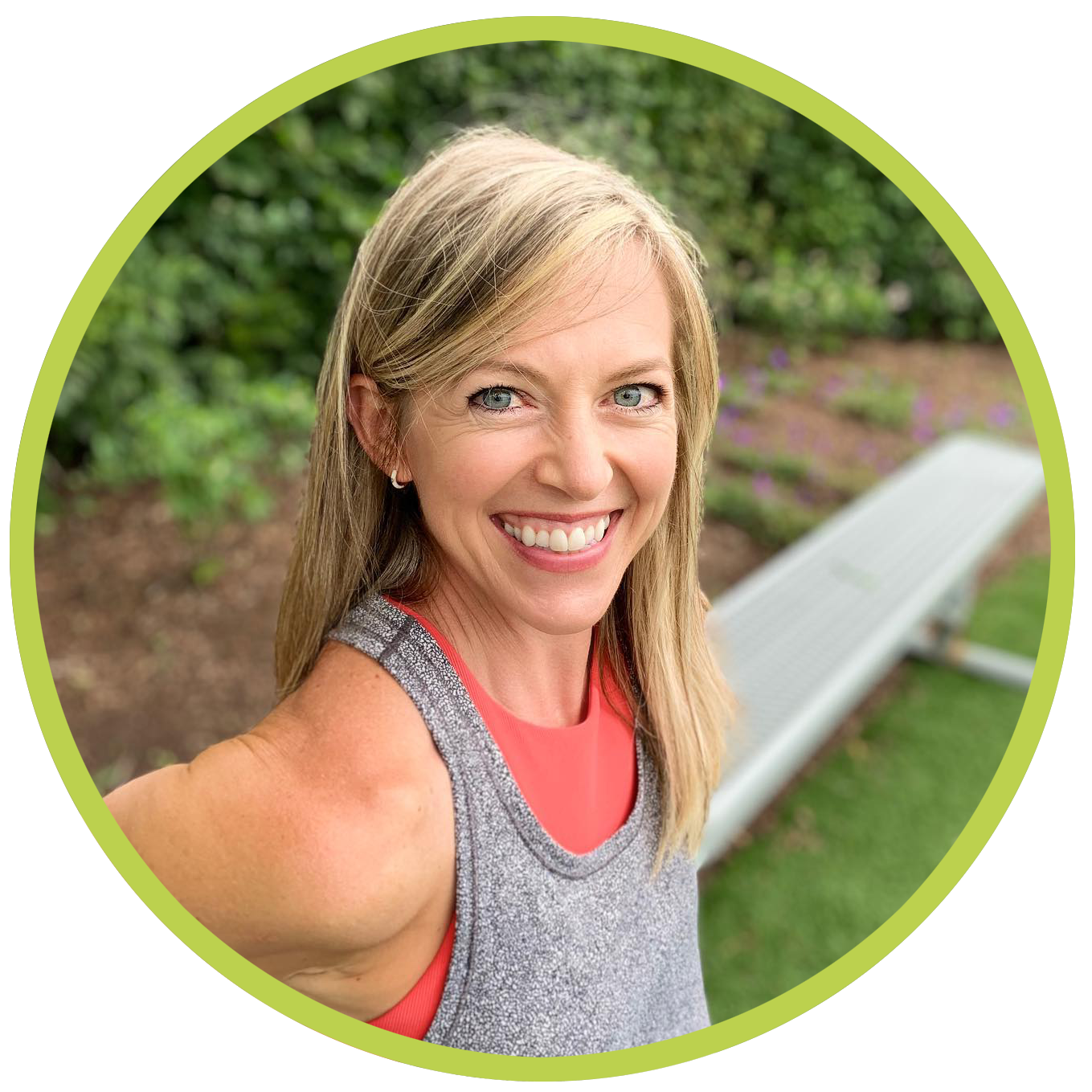 Personal trainer Meryl Marciante smiling while using a park bench to work her triceps.