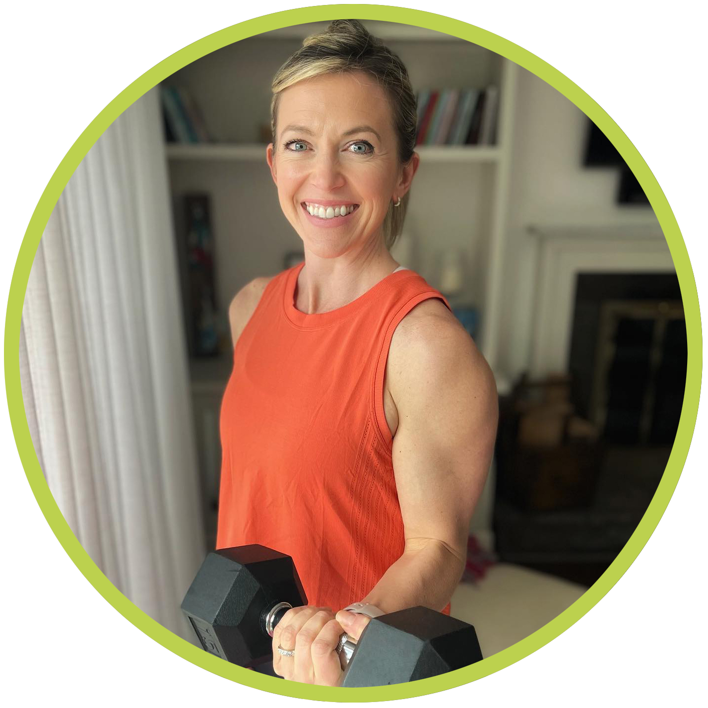 Personal trainer Meryl Marciante smiling in an orange tank top while holding a dumbbell.